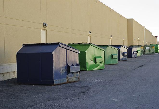 a group of dumpsters lined up along the street ready for use in a large-scale construction project in Clyde Hill, WA